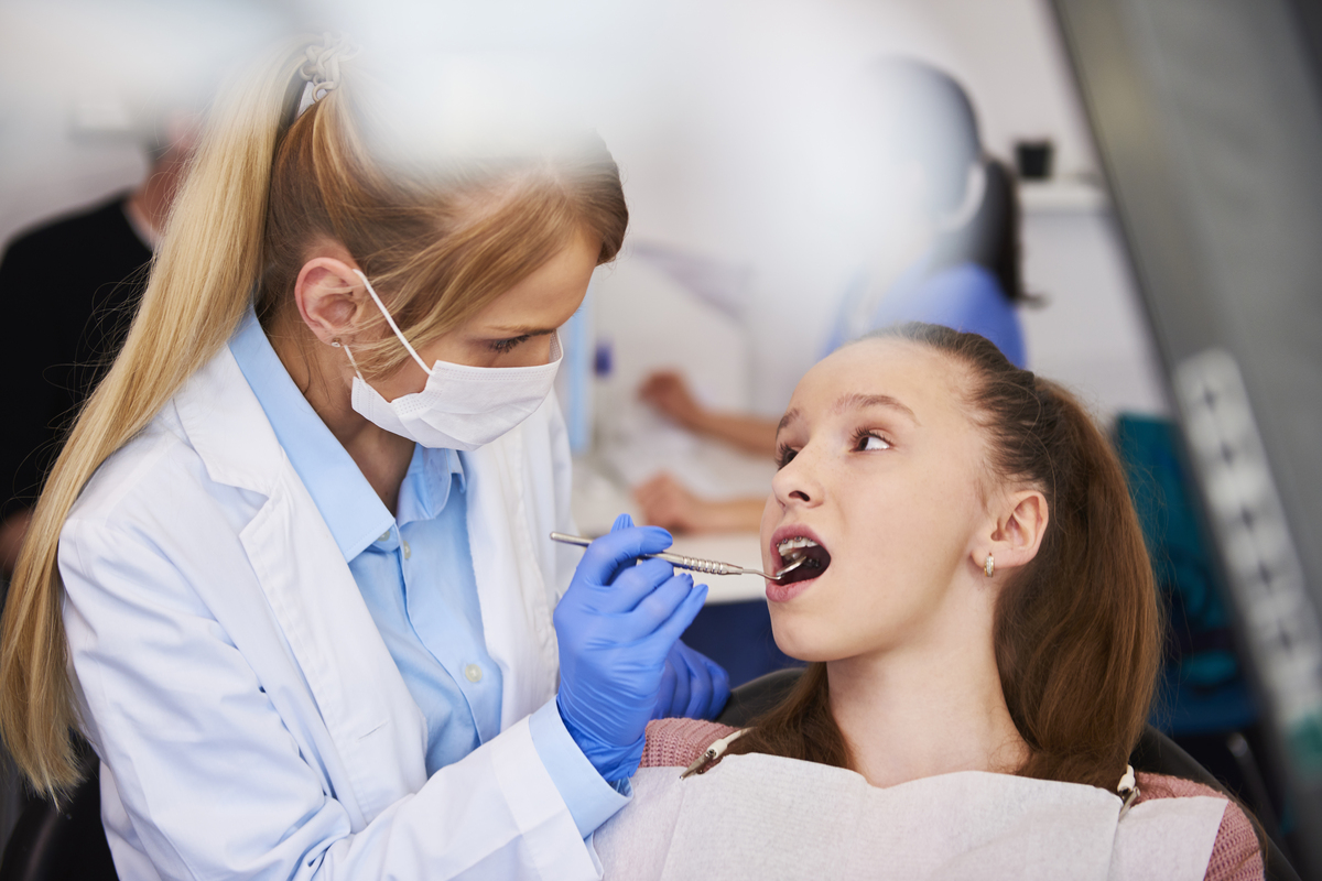 female getting dental exams