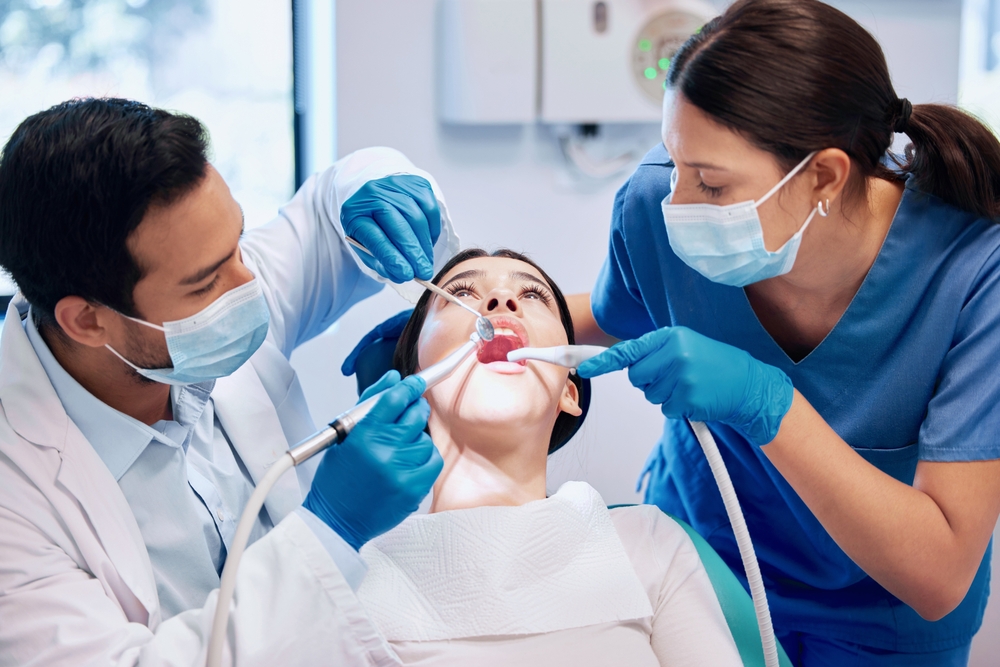 doctors doing tooth extraction